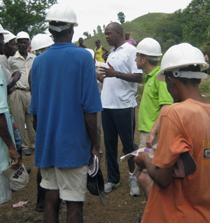 Yves discusses the St. Mattieu School project with workers